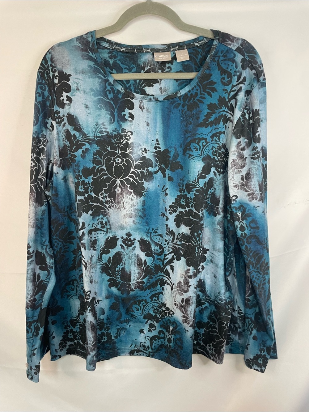 Chicos Zenergy teal and black blouse. Very cute and comfy.